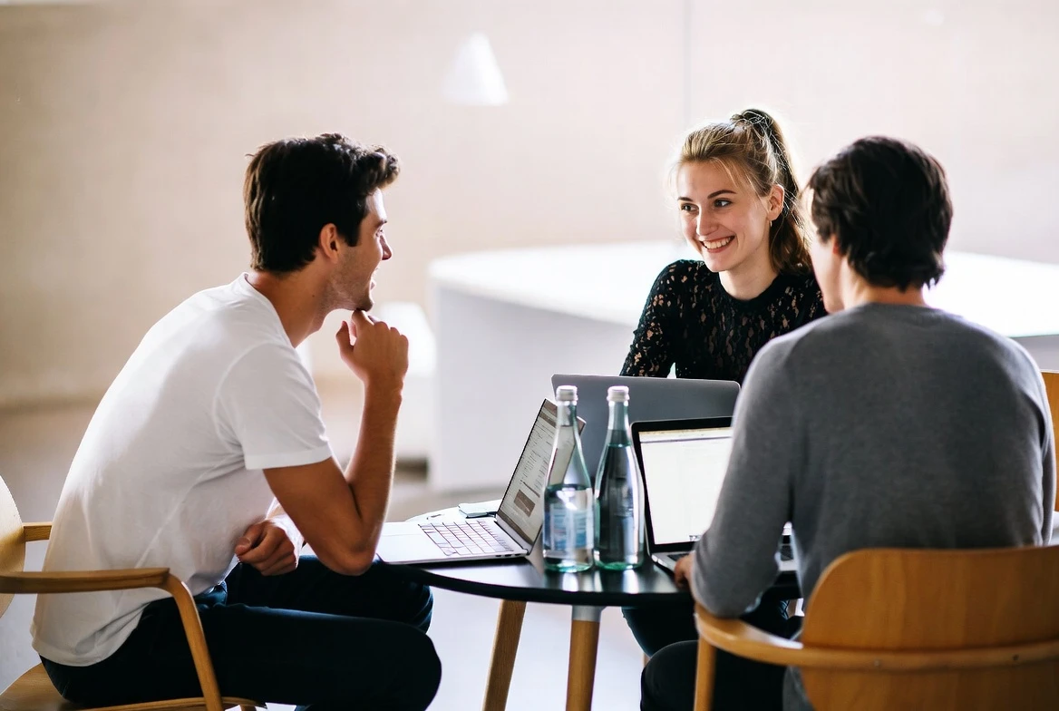 Team meeting with laptops